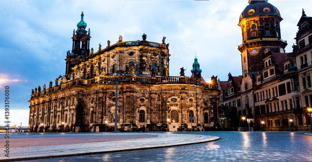 Fototapeta premium Historic Dresden Cathedral and Surrounding Architecture Illuminated at Dusk in Dresden, Germany