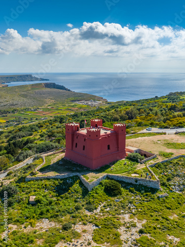 Drone aerial view of Red tower on Malta island, Mellieha city