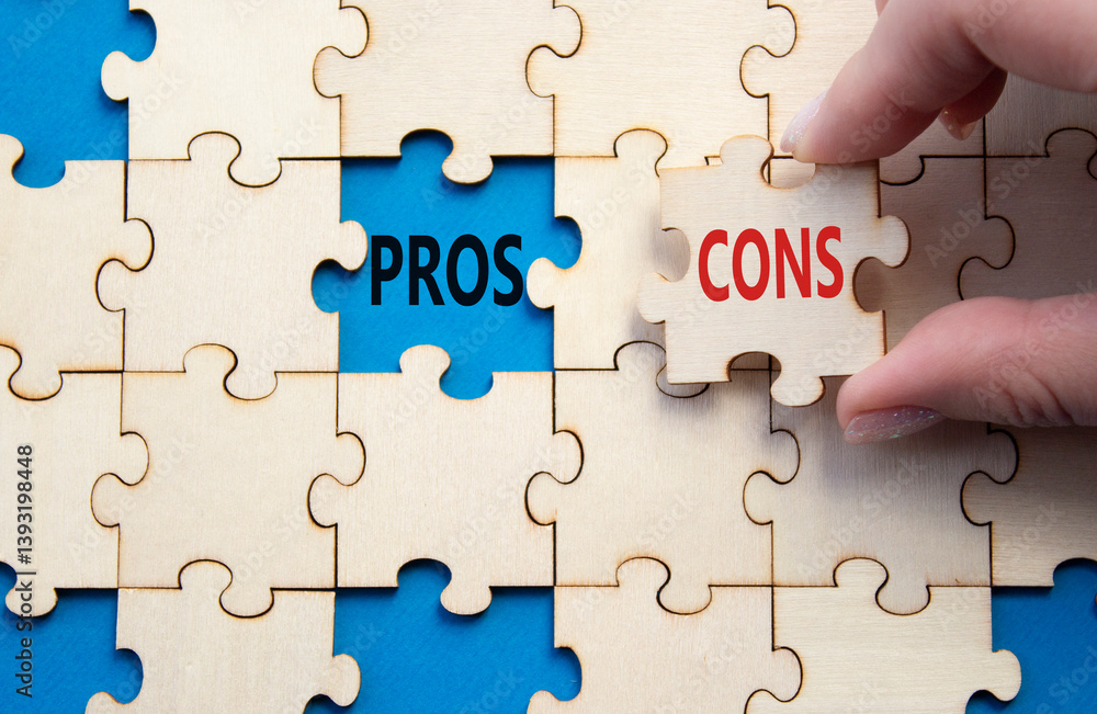 Pros vs Cons symbol. Concept word Pros vs Cons on wooden puzzle. Businessman hand. Beautiful blue background. Business and Pros vs Cons concept. Copy space Pros vs Cons symbol. Concept word Pros vs Cons on wooden puzzle. Businessman hand. Beautiful blue background. Business and Pros vs Cons concept. Copy space