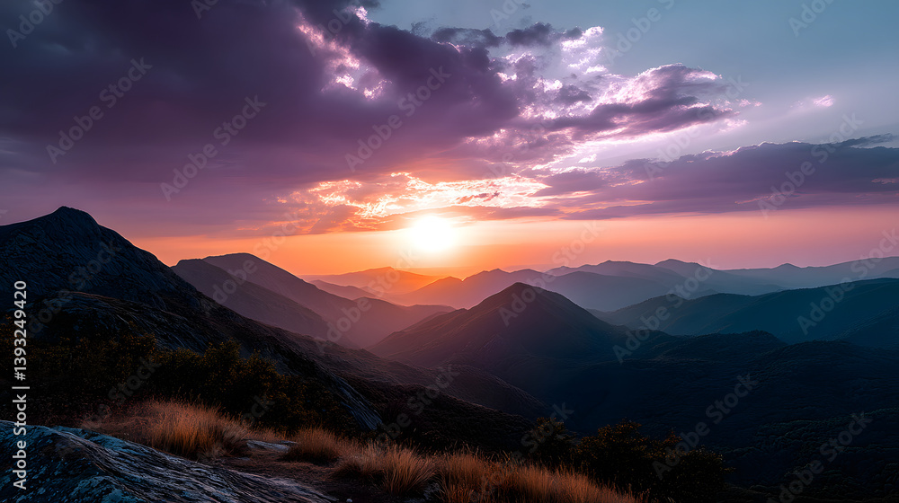 Obraz premium A wind farm in a lush green valley, with turbines turning slowly as the sun sets behind the mountains, casting a warm glow.