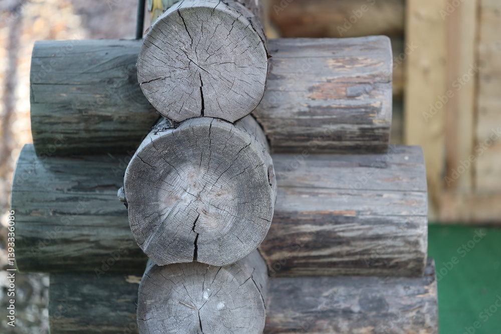 A pile of logs sitting together, often used as a decorative or functional element in homes and gardens.