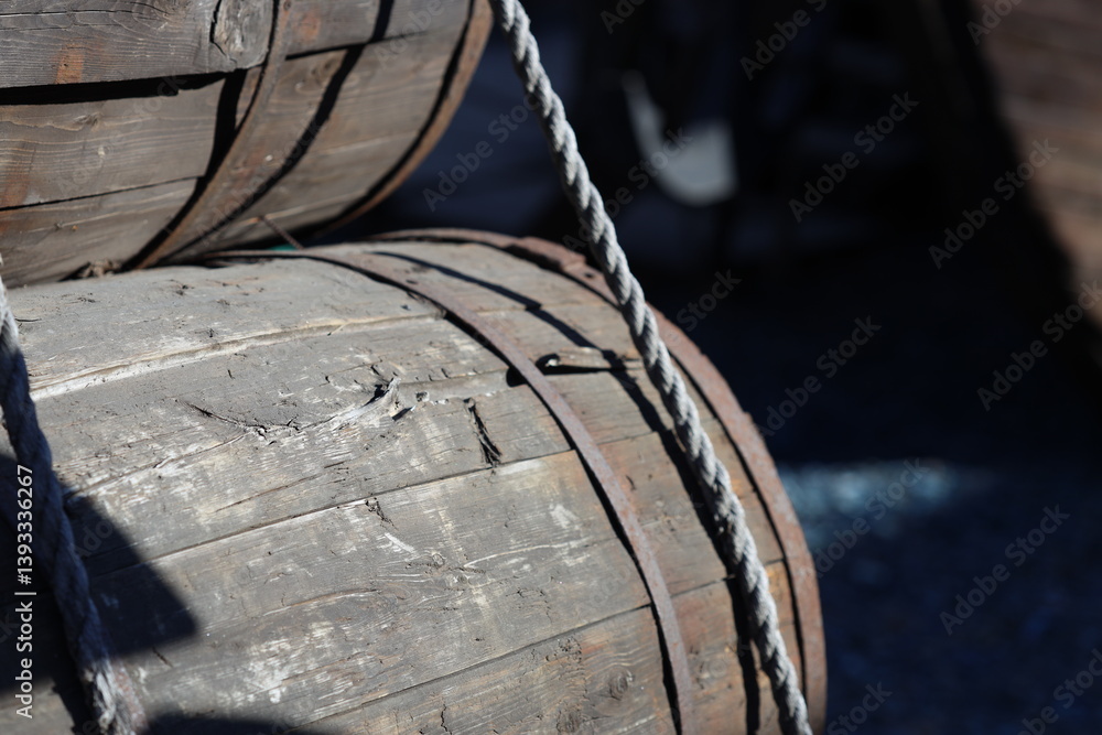 Two wooden barrels placed together, often used as storage or decoration.