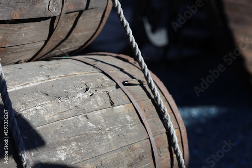 Obraz na płótnie Two wooden barrels placed together, often used as storage or decoration. w salonie