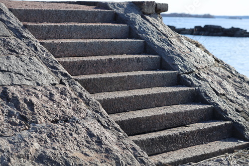 Obraz na płótnie Stairs near a body of water, perfect for travel or outdoor use. w salonie