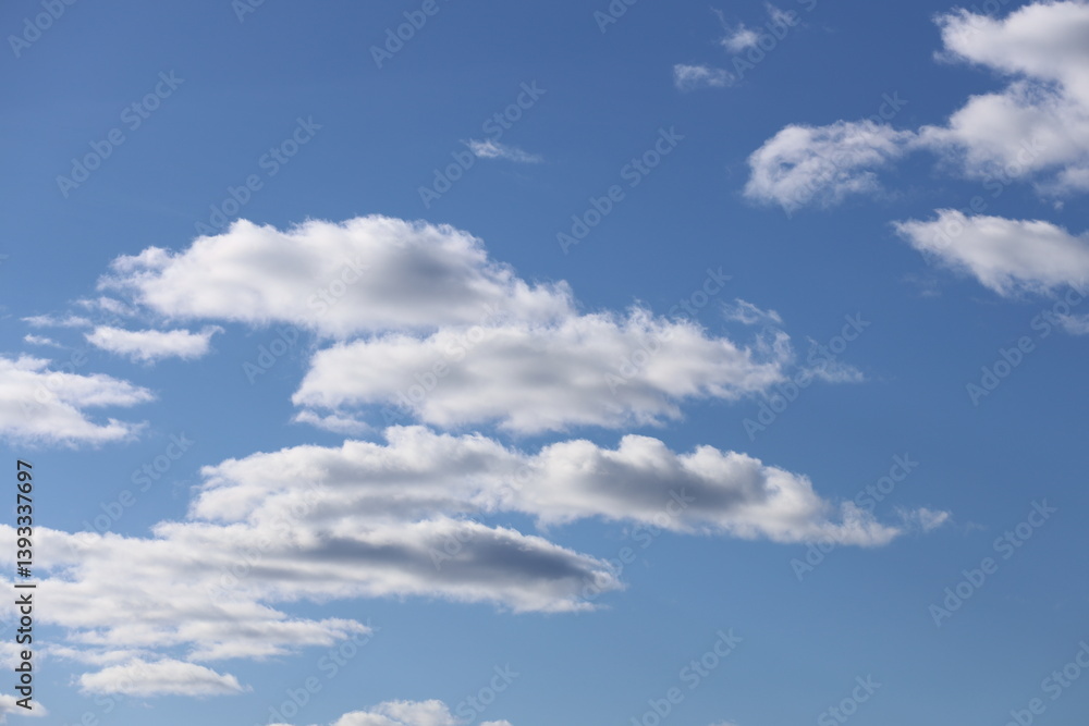 White clouds in a blue bright sky.