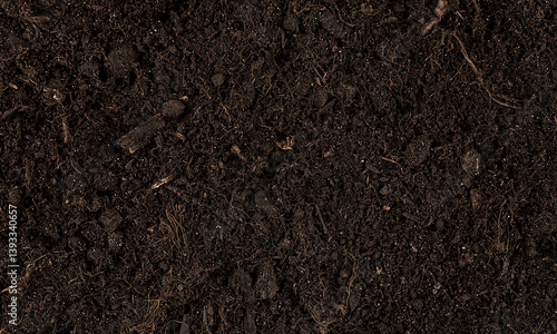 Brown fertile soil for planting as background, top view. Ecology concept. Agriculture and farming background.