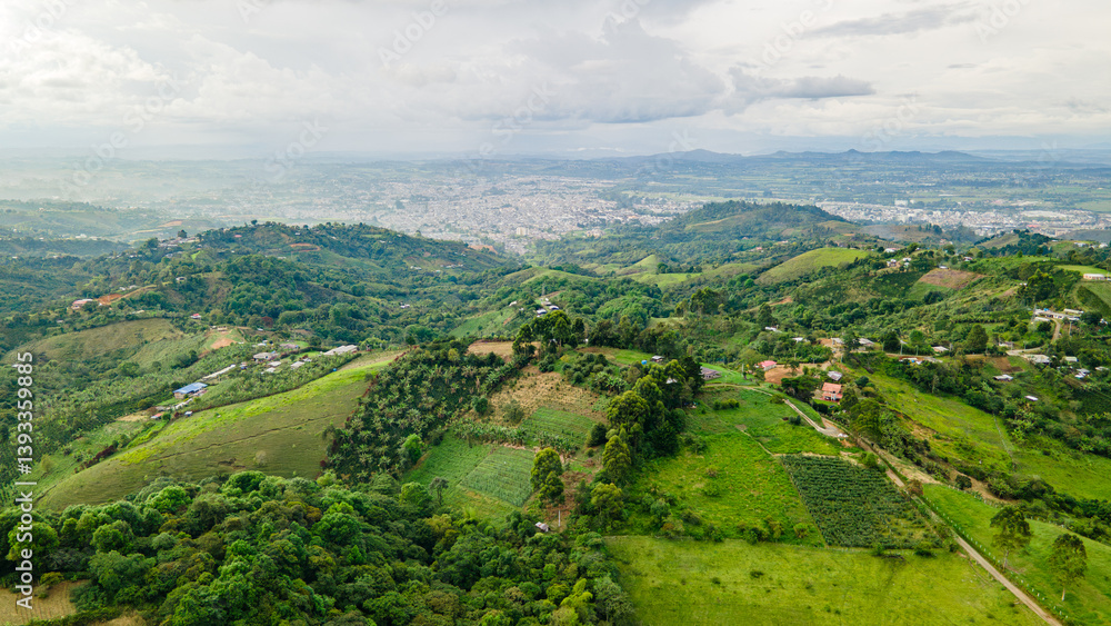 Obraz premium Aerial View of Lush Green Hills and Popayan Cityscape in Cauca, Colombia