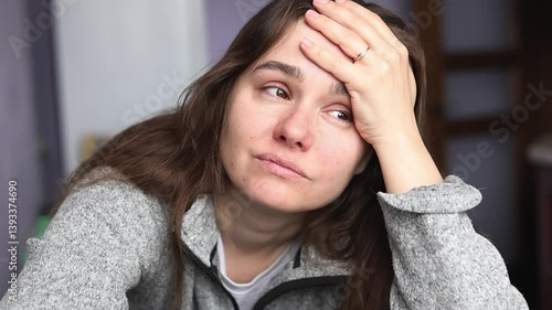 Sad tired woman at home