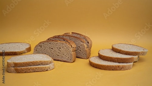 Obraz na płótnie Freshly cut bread arranged neatly on a table, perfect for a snack or breakfast w salonie