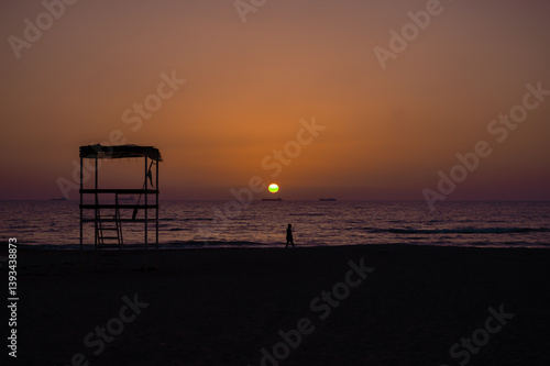 Obraz na płótnie Scenic sunset over the sea in Albania. Vibrant sky with warm orange and pink hues reflecting on the calm water. w salonie