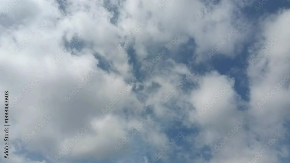 Timelapse cumulus clouds against a blue sky capturing the beauty of nature's serenity Timelapse cumulus clouds against a blue sky capturing the beauty of nature's serenity