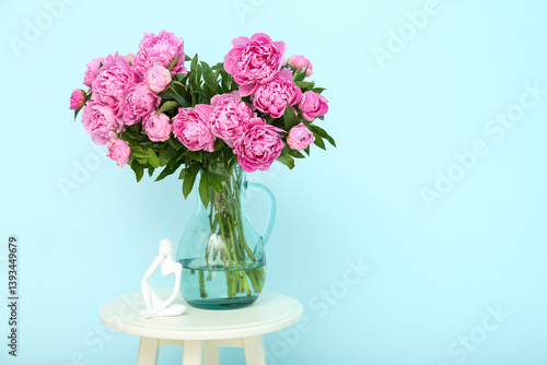 Wallpaper Mural Vase of pink peonies with figurine on chair near blue wall Torontodigital.ca