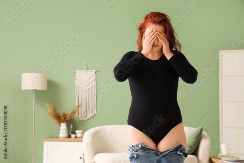 Upset young overweight woma...