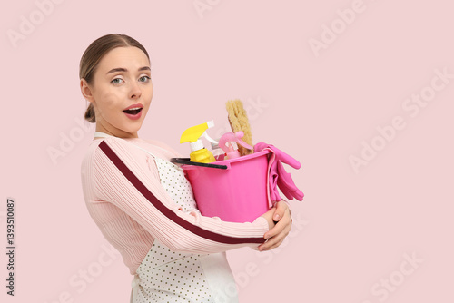 Pretty young woman holding ...