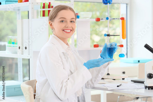 Female chemist with flask a...