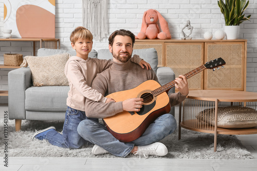 Dad and his little son play...