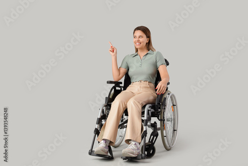 Young woman in wheelchair p...