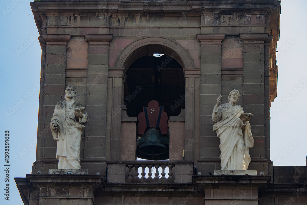 Obraz premium Bell tower close up and saints on the sides