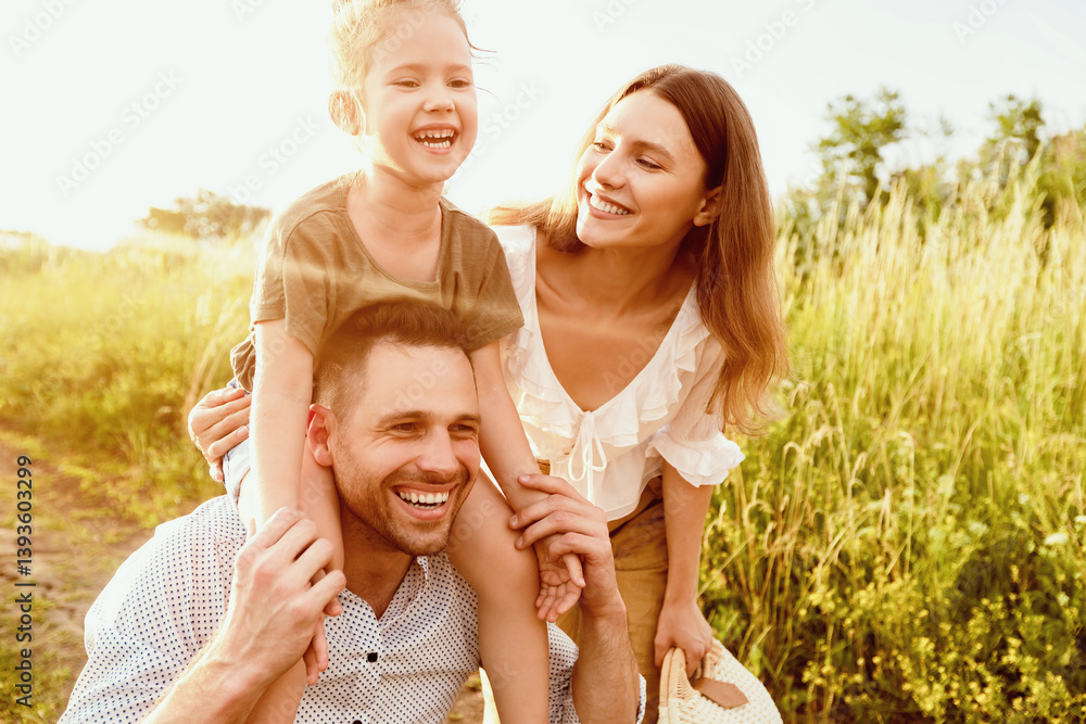 Obraz premium Portrait of lovely daughter smiling and sitting on the neck of her handsome father, mom emracing her