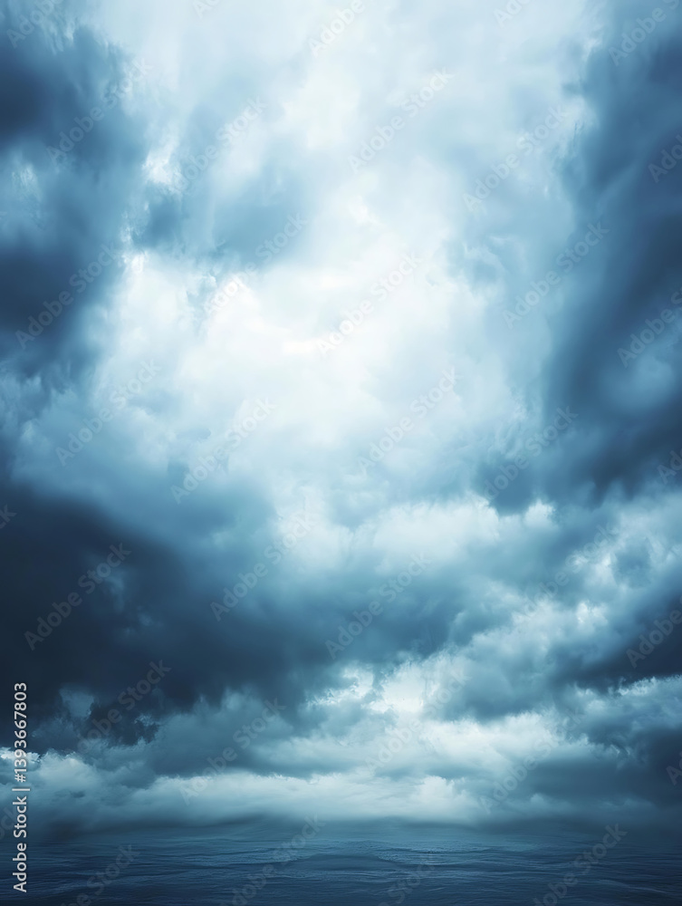 Obraz premium Dramatic clouds swirl in a deep blue sky hinting at an approaching storm with a bright opening in the center.