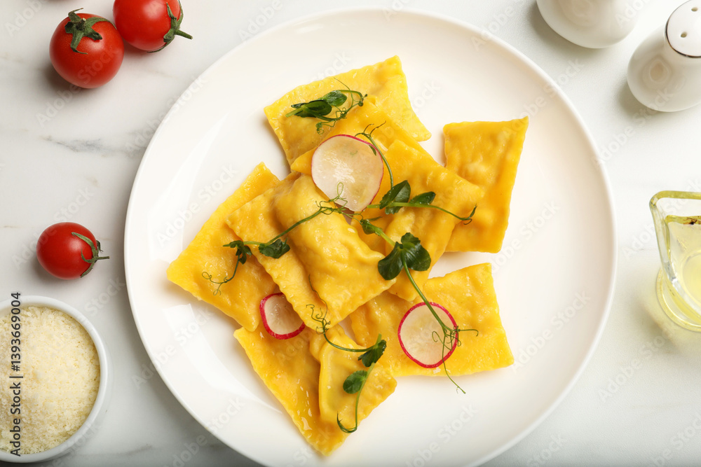 Delicious ravioli with microgreens, radish and other products on light table, flat lay Delicious ravioli with microgreens, radish and other products on light table, flat lay