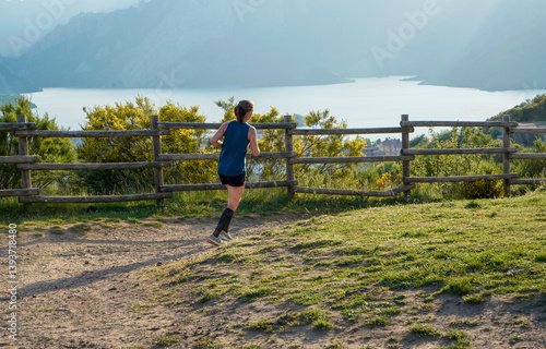 Young female athlete training on the hil
