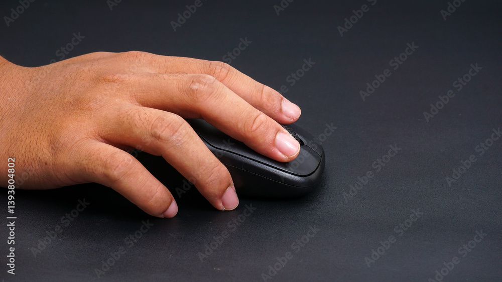 Man hand holding computer mouse isolated on black background Man hand holding computer mouse isolated on black background