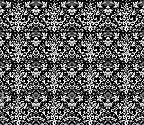 Wallpaper in the style of Baroque. Seamless vector background. White and black floral ornament. Graphic pattern for fabric, wallpaper, packaging. Ornate Damask flower ornament.