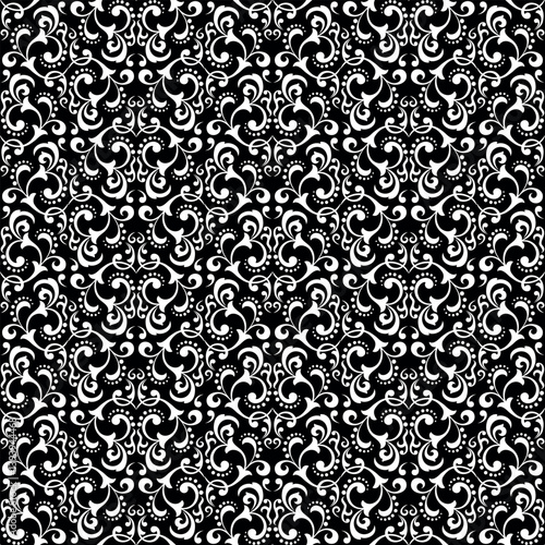 Wallpaper in the style of Baroque. Seamless vector background. White and black floral ornament. Graphic pattern for fabric, wallpaper, packaging. Ornate Damask flower ornament.