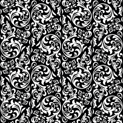 Wallpaper in the style of Baroque. Seamless vector background. White and black floral ornament. Graphic pattern for fabric, wallpaper, packaging. Ornate Damask flower ornament.