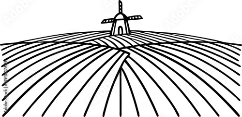 windmill on vast farmland rural landscape with plowed fields renewable energy and agriculture