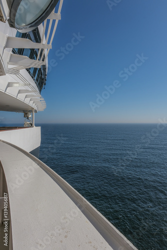 Obraz na płótnie Views onto outdoor teak balcony terrace veranda promenade boat deck of ocean liner cruiseship cruise ship with chairs and loungers at sea during Transatlantic Crossing to New York on beautiful sun day w salonie