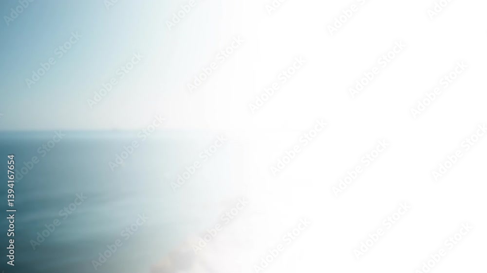 Ocean waves crashing on beach, animation of bright sunlight reflecting on water