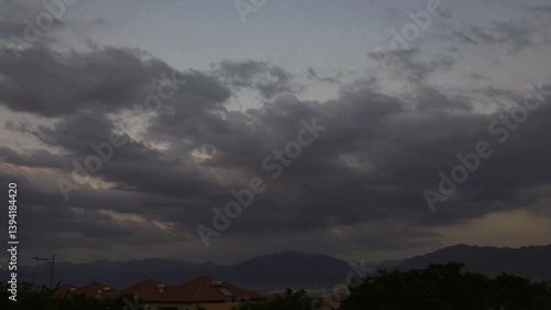 Time lapse of clouds over the Jordanian mountains and Aqaba city