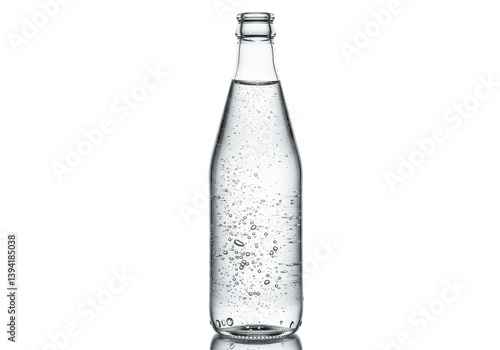 Clear glass bottle filled with sparkling water, isolated on a white background