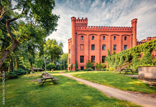 Stunning morning view of red bricks Jan III Sobieski Casttle. Majestic summer cityscape of Rzucewo village, district of Gmina Puck, within Puck County, Poland, Europe. Traveling concept background.