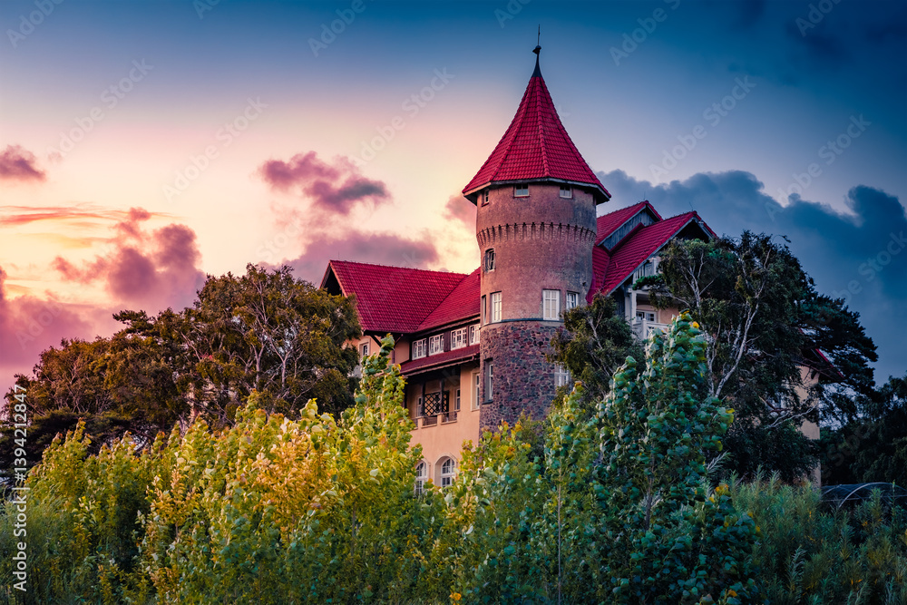 Dramatic summer sunrise on Leba castle, Pomeranian Voivodeship, Poland, Europe. Fantastic mornivg view of the Bultic architecture. Vacation concept background.