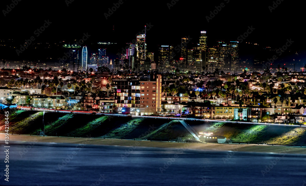 City lights of Downtown Los Angeles light up the background of the South Bay on a clear night