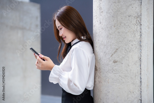 Obraz na płótnie Portrait of beautiful happy Smiling asian woman relaxingread writing message on smartphone using casual working in cafe interior in coffee shop background,Business Lifestyle summer holiday concept w salonie