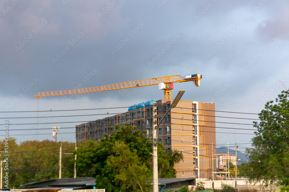 Construction Site with Crane and Modern Building
