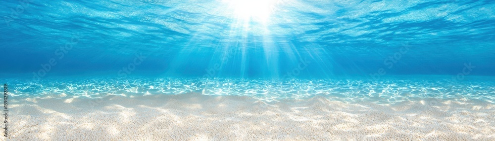 Fototapeta premium Crystal Clear Turquoise Waters with Sunlight Rays Illuminating Sandy Ocean Floor