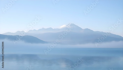 large body of water with mountains in the background