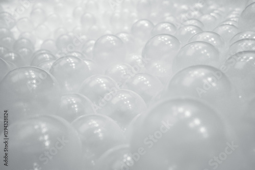 Heap of transparent plastic balls in pit playground. 