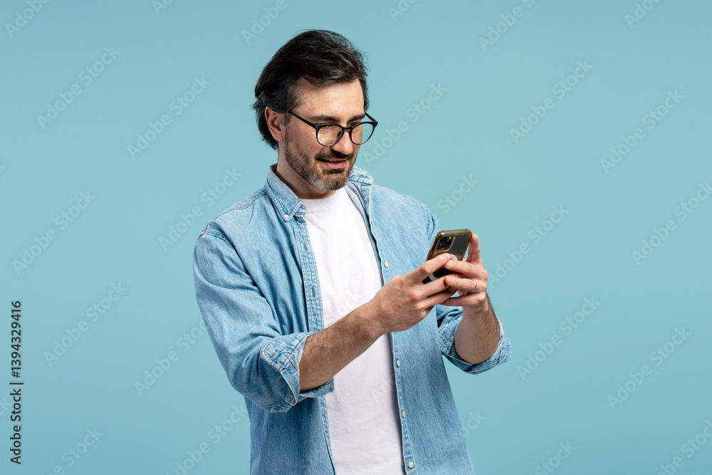 Casual businessman using mobile phone, browsing internet, chatting online, ordering, shopping, blue background