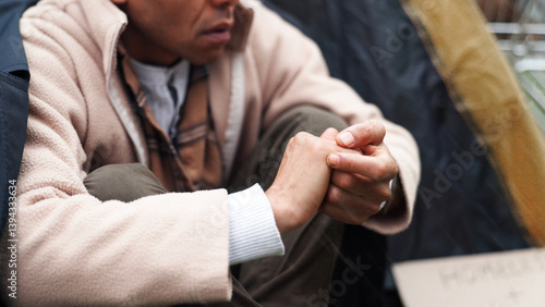 Homeless, poverty and winter with hands of person for depression, unemployment rate and crisis. Mental health, refugee and welfare aid with closeup of beggar and tent for tired, poor and worry