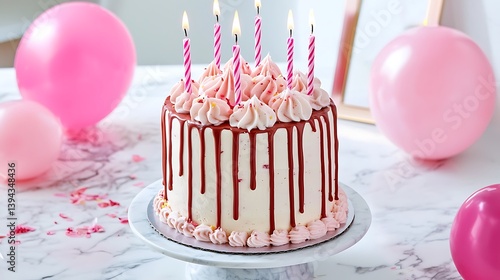 Obraz na płótnie A frosted birthday cake with lit candles and pink balloons w salonie