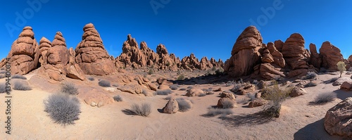 Obraz na płótnie Panoramic view of weathered rock formations under a clear blue sky w salonie