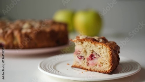 Homemade apple and rhubarb pie. Housewife cutting a piece of a cake