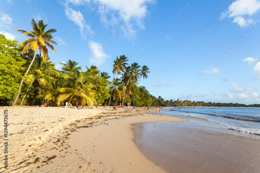 People on tropical beach in Martinique island, Caribbean People on tropical beach in Martinique island, Caribbean