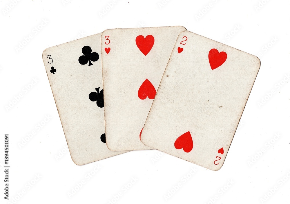 Obraz premium A hand of three vintage playing cards isolated on a white background.